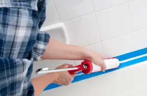 caulking on shower floor helps with shower waterproofing.